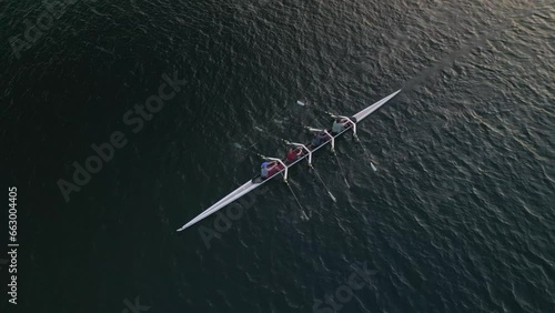 Aerial View Quadruple Scull Boat with four Rowers Prepares to Compete in a Race  photo