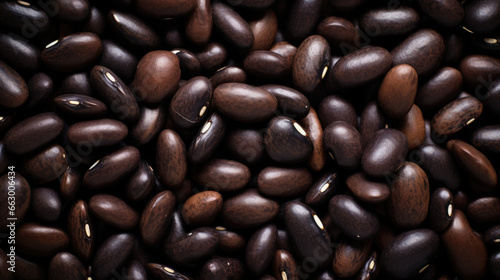 A close-up view of a substantial pile of black or dark brown beans  showcasing their texture.Generative AI