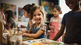 Young child artists growing up in a community art class smile, paint and encourage each other's creativity.