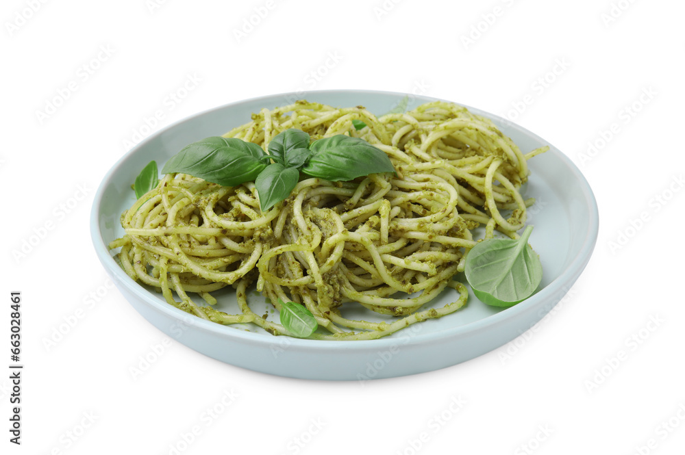 Plate of delicious pasta with pesto sauce and basil isolated on white