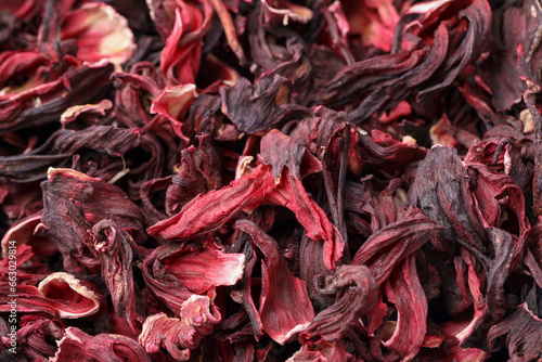 Dry hibiscus tea as background, closeup view