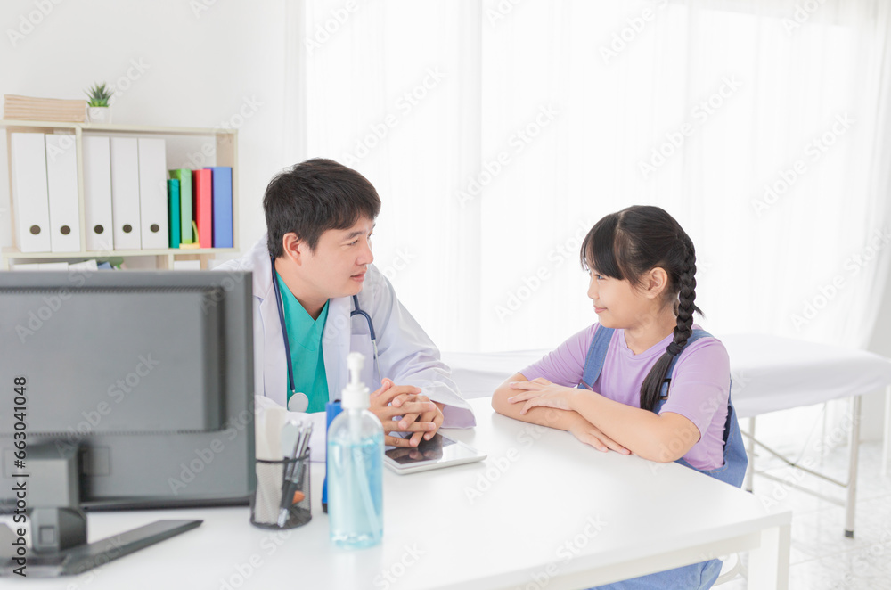 asian doctor diagnosis and explaning to child patient about disease symptoms, treatment process in hospital asian doctor diagnosis and explaning to child patient about disease symptoms, treatment process in hospital