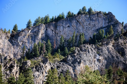 granite mountains with evergreen trees, utah