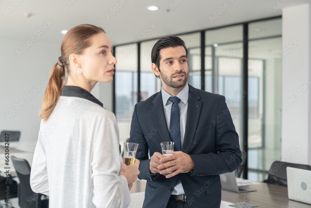 Business people drinking champagne to celebrate success of investment agreement after meeting, teamwork and partnership concept. Business people drinking champagne to celebrate success of investment agreement after meeting, teamwork and partnership concept.