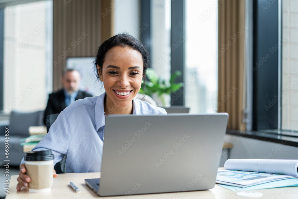 Latino beautiful businesswoman using laptop computer working in office. Latino beautiful businesswoman using laptop computer working in office.