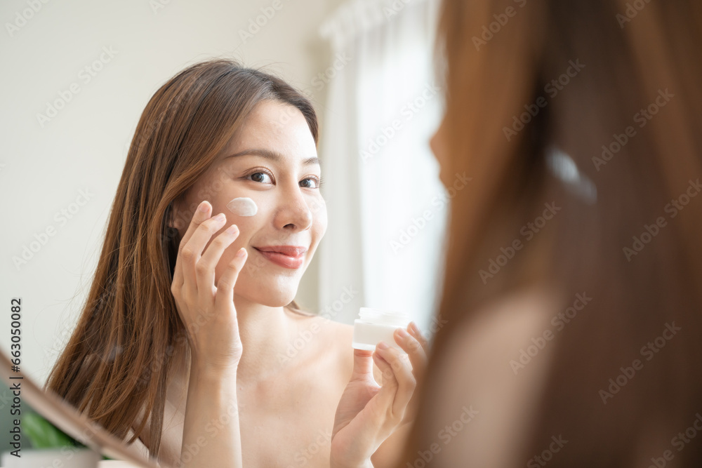 woman applying makeup woman applying makeup