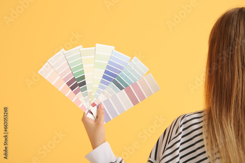 Young woman with color samp...