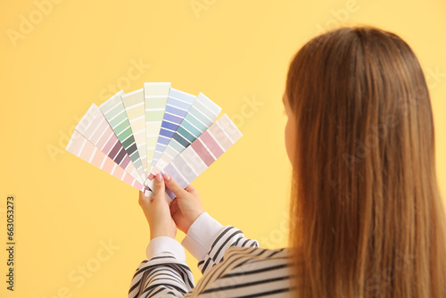 Young woman with color samp...