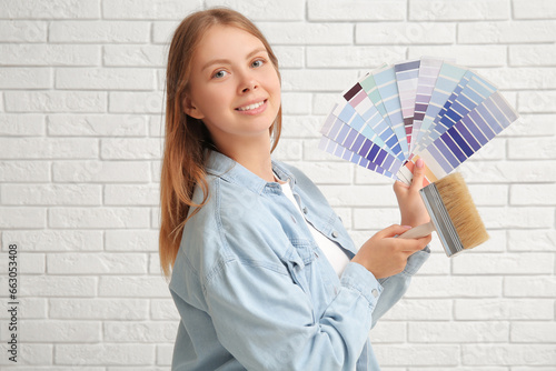 Young woman with color samp...