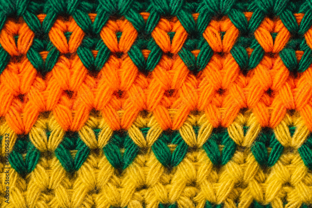 Background of striped knitted sweater in different colors.