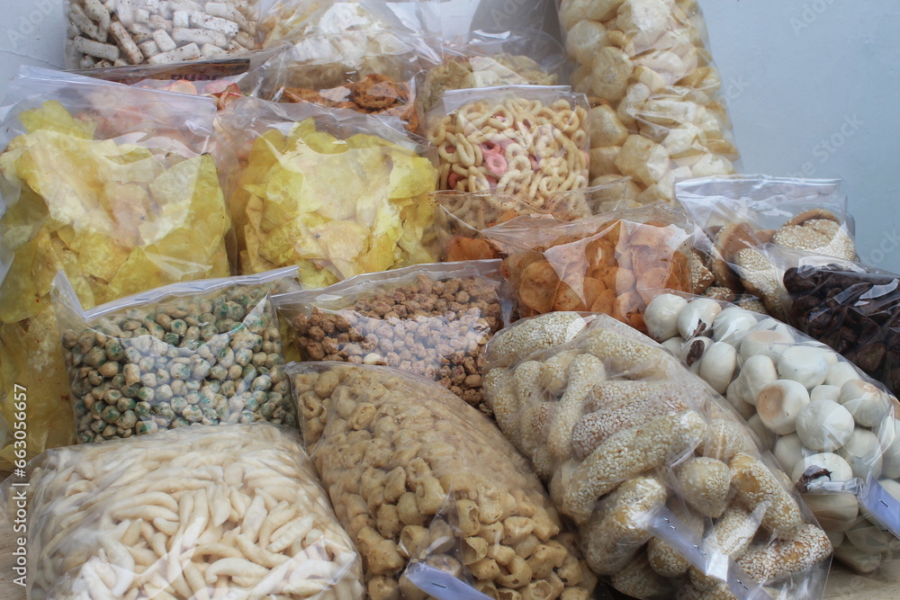 Various kinds of Indonesian snacks in plastic on the table