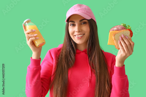Young woman with tasty sand...