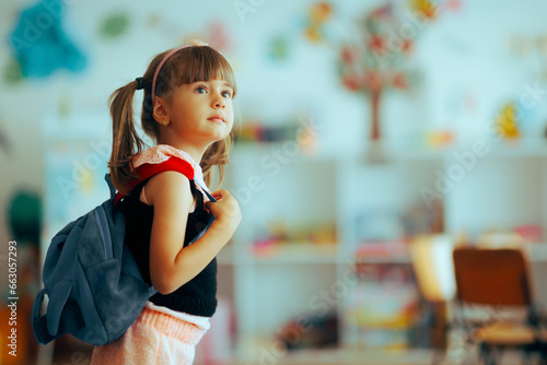 Happy Girl Wearing a Backpack Going Back to Preschool. portrait of a young preschoolers returning to kindergarten 