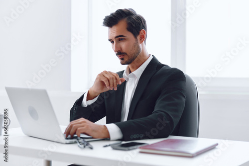 Man professional looking laptop tired sitting businessman office business desk working person occupation computer