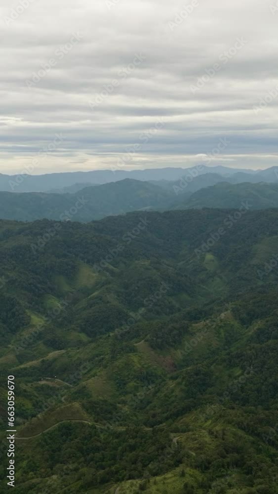Aerial drone of mountains and hills with green forest and trees in the tropics. Sumatra, Indonesia. Aerial drone of mountains and hills with green forest and trees in the tropics. Sumatra, Indonesia.