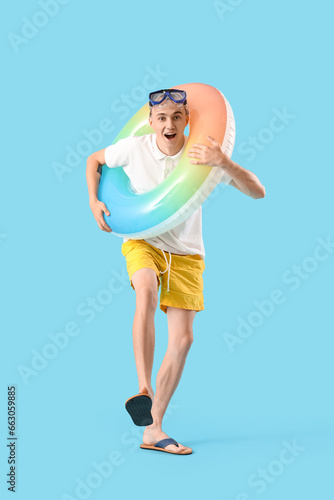 Young man with snorkeling m...