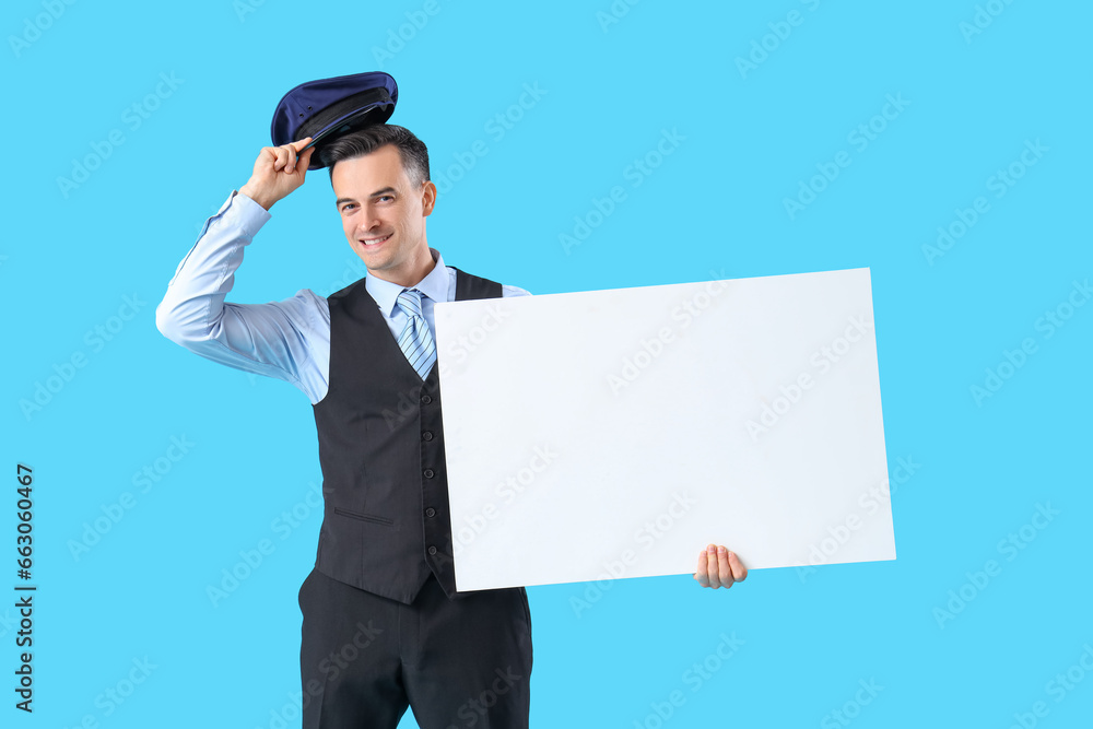 Handsome steward with blank poster on blue background Handsome steward with blank poster on blue background