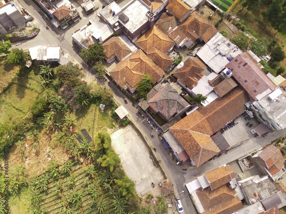 Drone Photography. Top down view of a small village and trees in a remote part of Manglayang Mount, Bandung - Indonesia. A remote settlement located at the top of a mountain