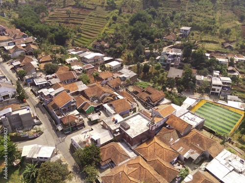 Bird's eye view of a developed residential area with cityscape and trees, Bojong Koneng - Bandung, Indonesia. Drone Photography, Aerial Photography, Landscape. photo