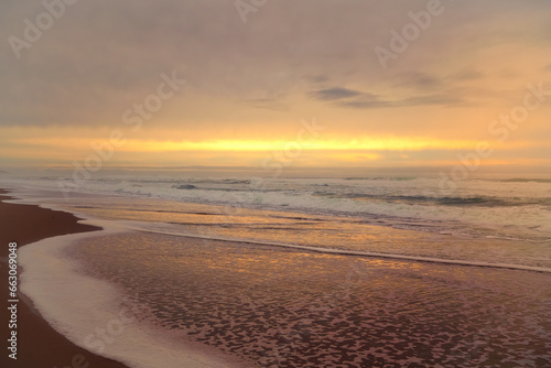 Golden sunset on the beach  and cloudy sky. Beautiful seascape  copy space