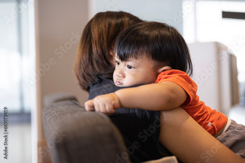 Sad Son Hugging His Mother