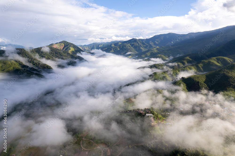 Top view Landscape of Morning Mist with Mountain Layer at north of Thailand. mountain ridge and clouds in rural jungle bush forest Top view Landscape of Morning Mist with Mountain Layer at north of Thailand. mountain ridge and clouds in rural jungle bush forest