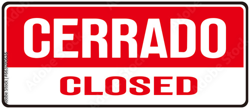 A sign that says in english and spanish : closed