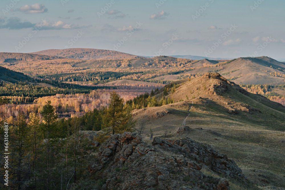 Autumn mountain landscape, view of mountain peaks, mountain valley 