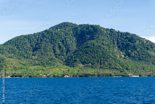 Popular tourist destination in Aceh, Indonesia. View of Sabang island from the boat. © fery