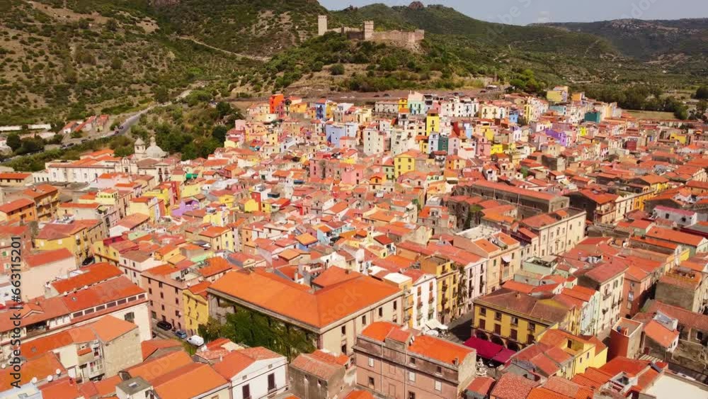 4k Aerial of Bosa town in Sardinia colorful houses flying forward above roofs 4k Aerial of Bosa town in Sardinia colorful houses flying forward above roofs