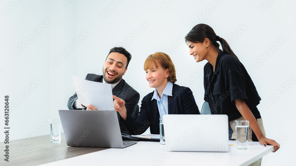 Three smiling diverse business colleagues having business strategy meeting. Three smiling diverse business colleagues having business strategy meeting.
