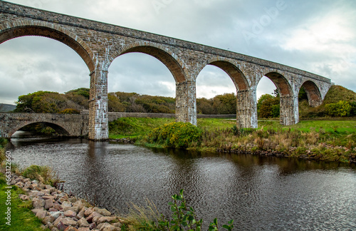 Cullen viaduct over the road and river with water reflection 
