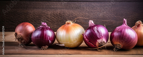 Onions on wooden board. Fresh onion against old wood table. copy space for text