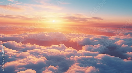 Sun goes into the clouds. Epic sunset in the sky, aerial shot. Flying above the clouds illuminated by the evening sun