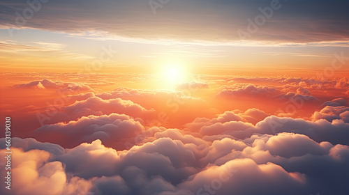 Sun goes into the clouds. Epic sunset in the sky, aerial shot. Flying above the clouds illuminated by the evening sun