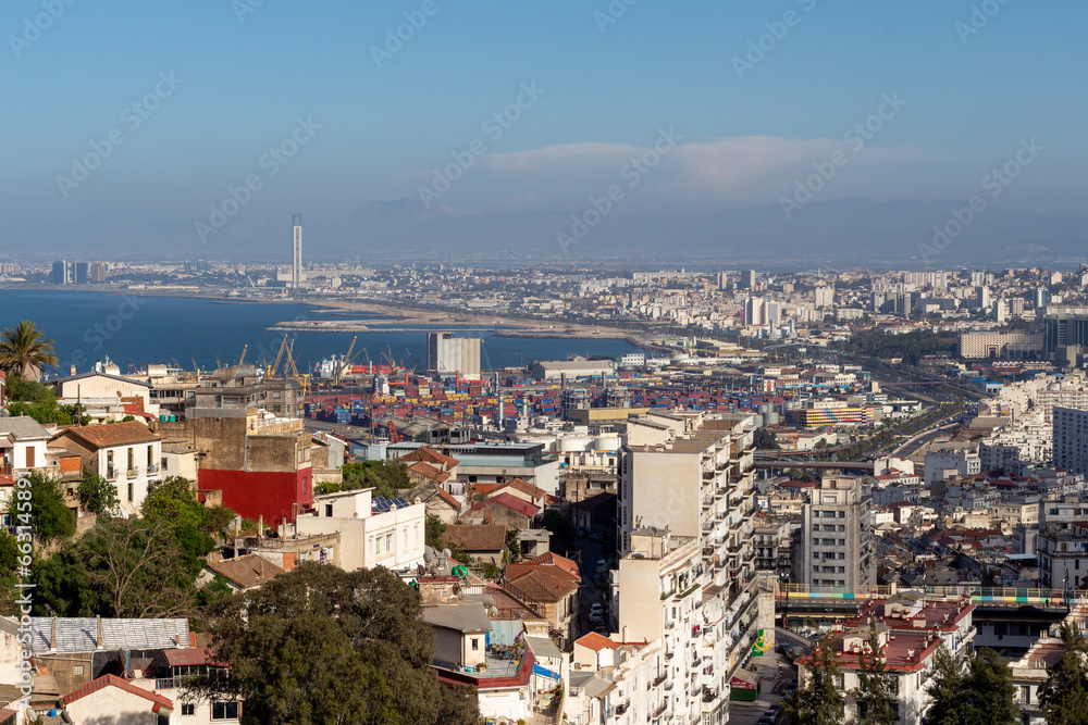 Beautiful panorama of the bay of Algiers, Alger, Algeria, with the industrial port and the Djamaa El-Djazaïr (English : Great Mosque) in the background.