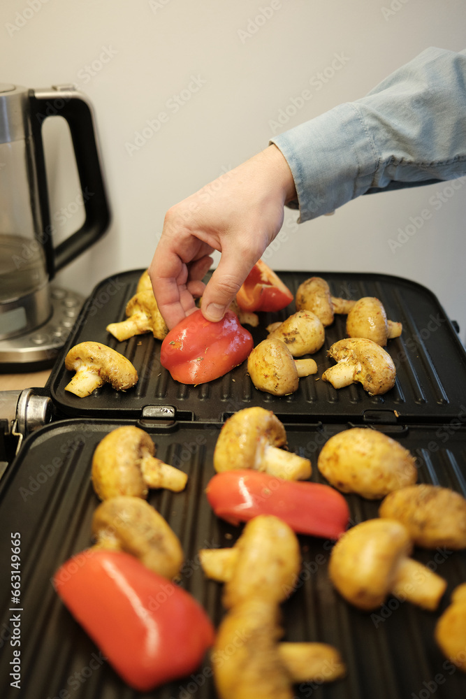 grilled mushrooms and red peppers in a grill pan grilled mushrooms and red peppers in a grill pan