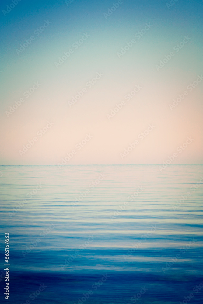 Background of sky and sea, sea is very calm with gentle ripples, with an instagram effect.