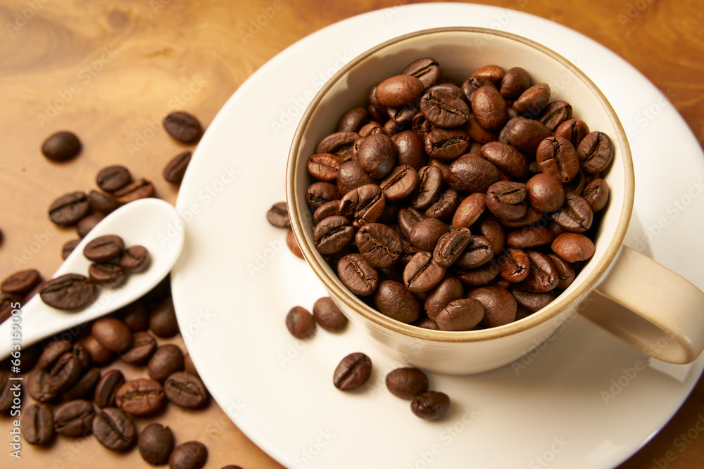Black coffee and coffee beans on Wooden table Black coffee and coffee beans on Wooden table