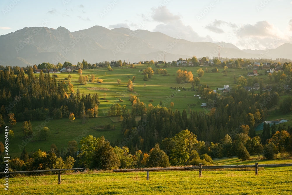 Obraz premium Views of rural farm fields and the Tatra Mountains from Suche, a village near Zakopane, Poland