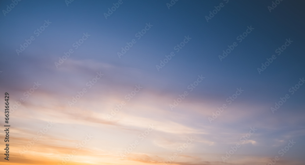 Minimalistic evening sky with clouds and sun glare, looking up at the sky in the evening