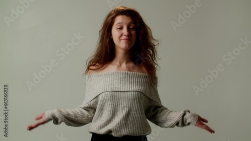 A young lady boss shows emotional coolness and unwillingness to bear responsibility for another blunder of a subordinate. Demonstration of closedness with crossed arms over chest. Gesture of spreading