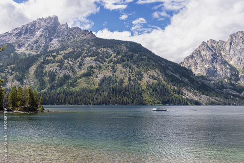 Jenny Lake and the Teton Range with a shuttle on the lake in the Grand Teton National Park