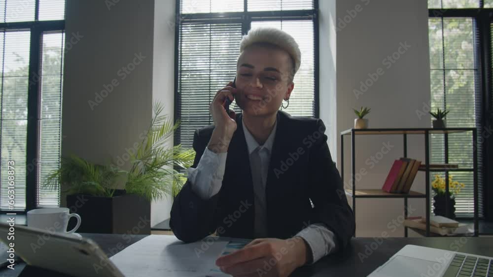 Young pleasant caucasian businesswoman chat with boyfriend using mobile phone. Student woman employee talking to friends via smartphone in office. Call center worker girl answering Young pleasant caucasian businesswoman chat with boyfriend using mobile phone. Student woman employee talking to friends via smartphone in office. Call center worker girl answering