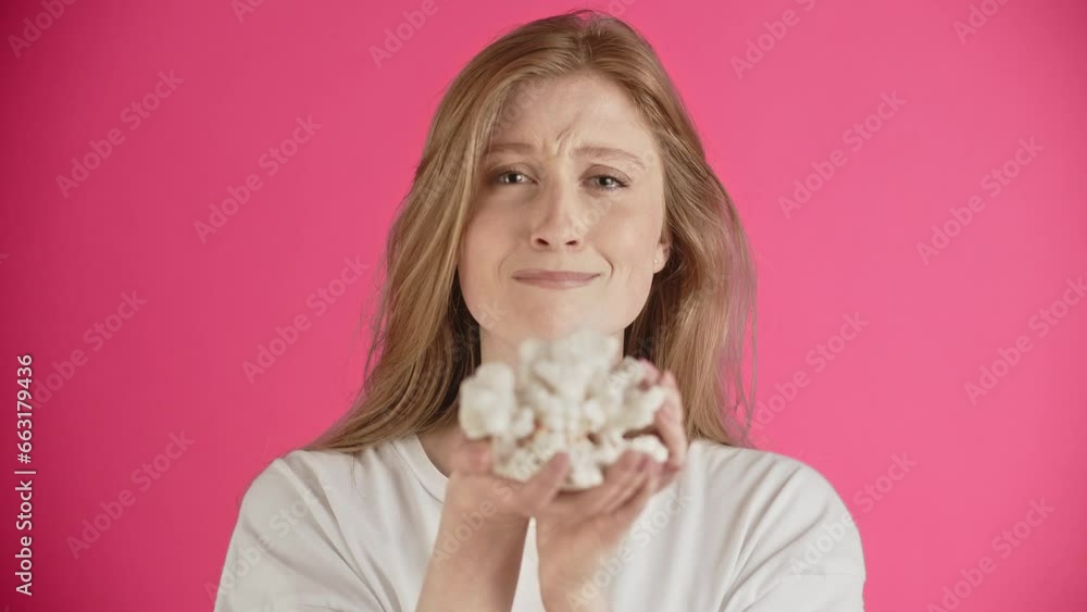 The girl experiences sublime sadness, cries and tries to correct guiltiness. Emotions of sentimentality and remorse. Young woman gives a present and wants reconciliation. Looks at camera. The girl experiences sublime sadness, cries and tries to correct guiltiness. Emotions of sentimentality and remorse. Young woman gives a present and wants reconciliation. Looks at camera.