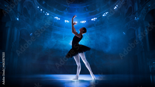 Elegant, artistic young woman, ballet dancer performing on theater stage with spotlights. Single ballerina dance. Concept of classical dance, art and grace, beauty, choreography, inspiration