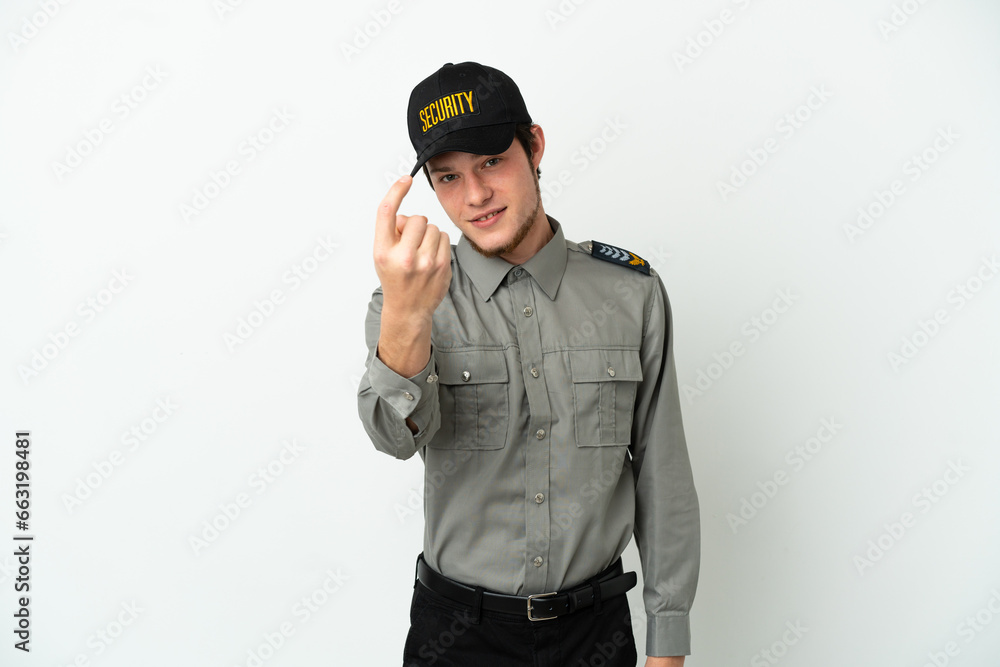 Young Russian security man isolated on white background doing coming gesture Young Russian security man isolated on white background doing coming gesture