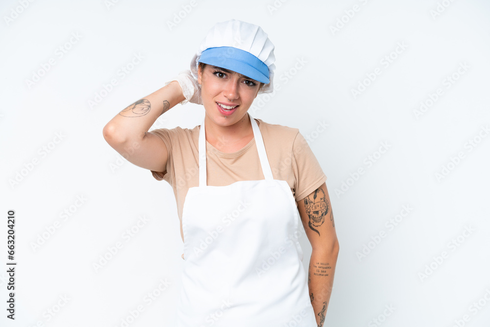 Fishmonger wearing an apron and holding a raw fish isolated on white background having doubts Fishmonger wearing an apron and holding a raw fish isolated on white background having doubts