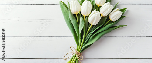 White Tulips composition with white background and copy space. Ideal concept for Valentines Day  Women s Day  Mother s Day  weddings