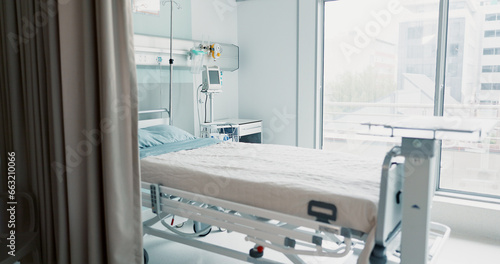 Hospital, healthcare or interior of bedroom or empty room for wellness, consulting or healing. Background, medical or clinic space for emergency, rehabilitation or recovery with furniture or light © N Felix/peopleimages.com